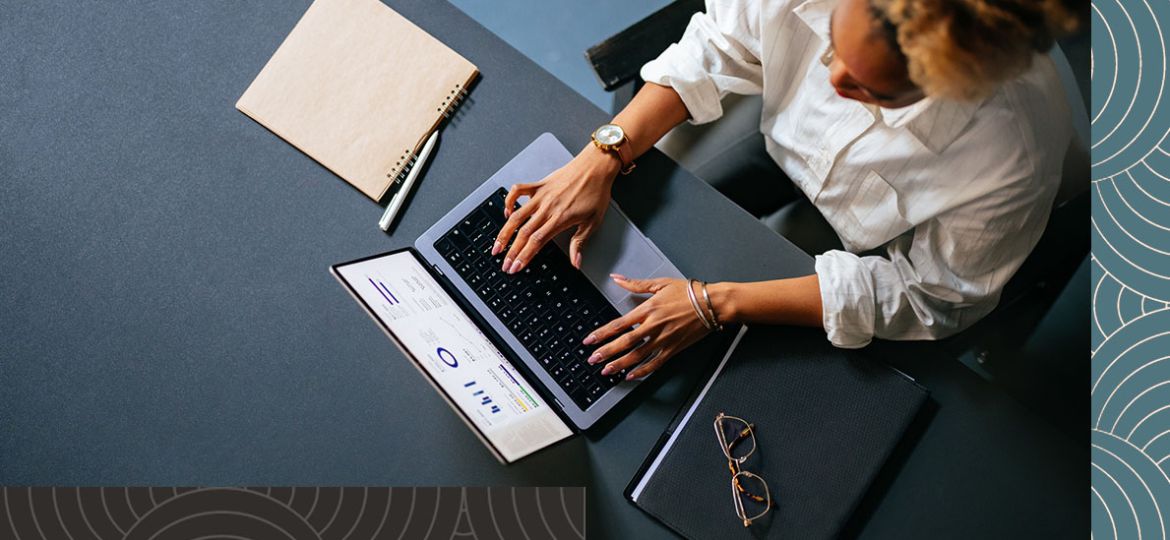 overview of professional woman working on a laptop