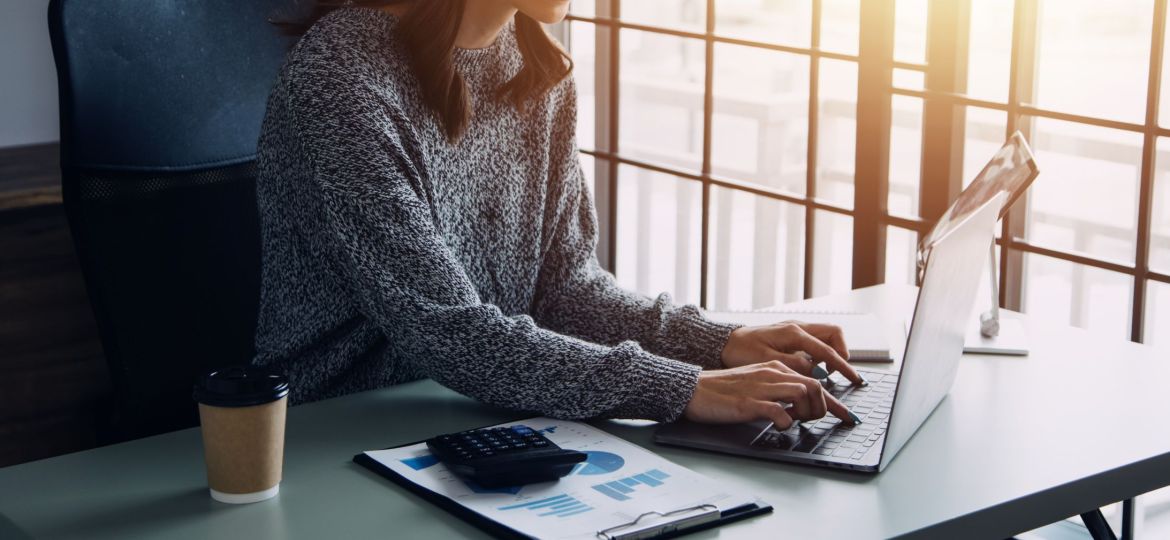 Close up of Business team analyzing income charts and graphs wit