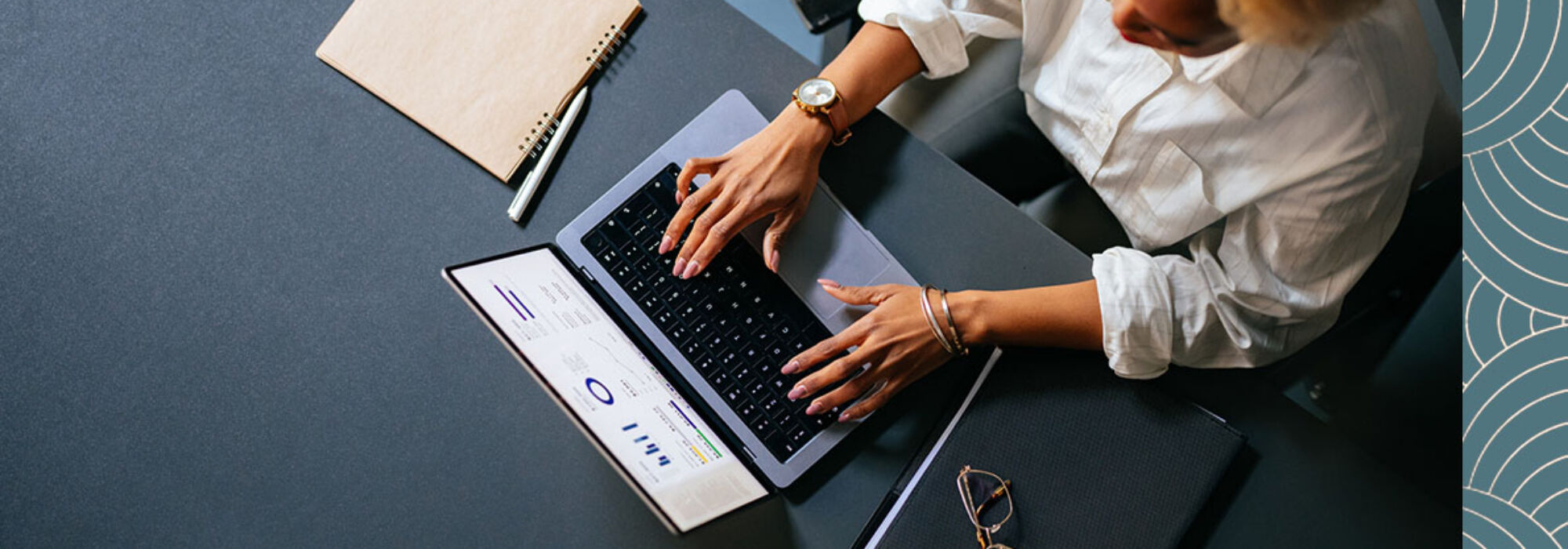 overview of professional woman working on a laptop